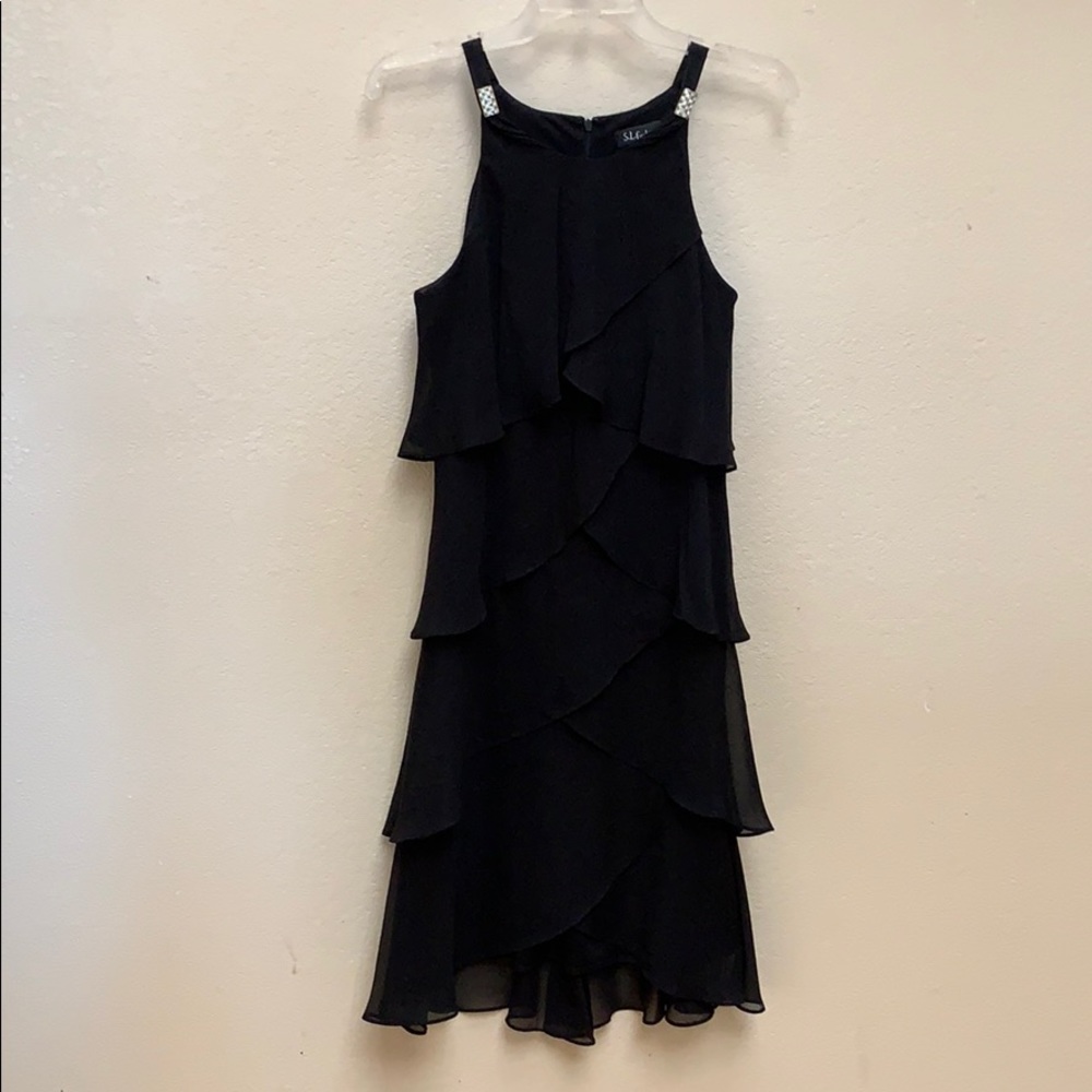 Gorgeous S.L. Fashions black dress with ruffles.